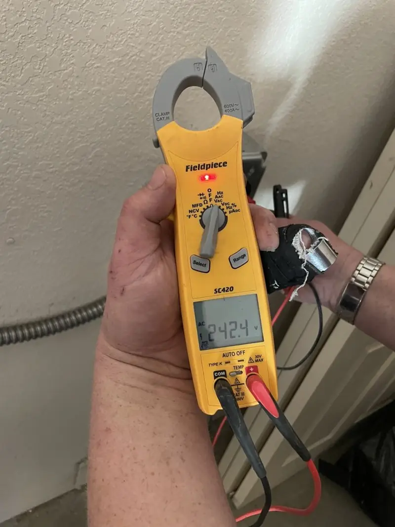 Voltage testing with clamp meter during Generator Installation in Wellington